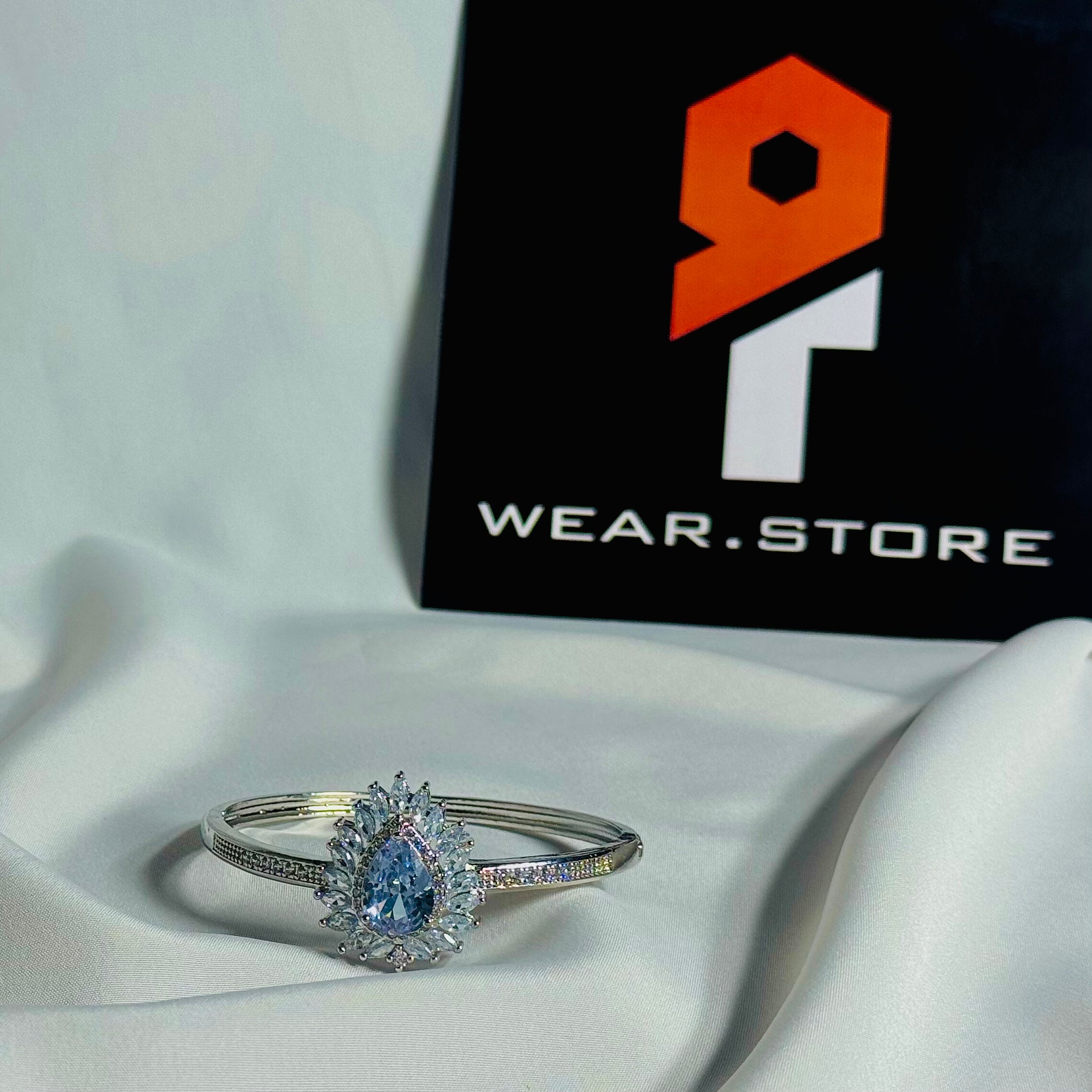 Silver Bangle With Icy Blue Stone