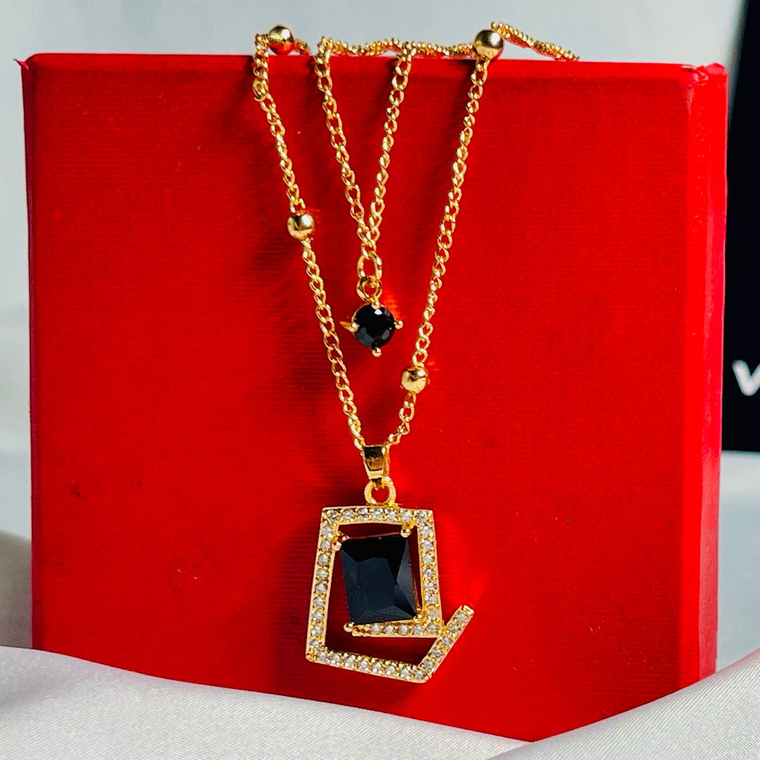 Golden Pendant Necklace With Black Stone & Crystal Accents