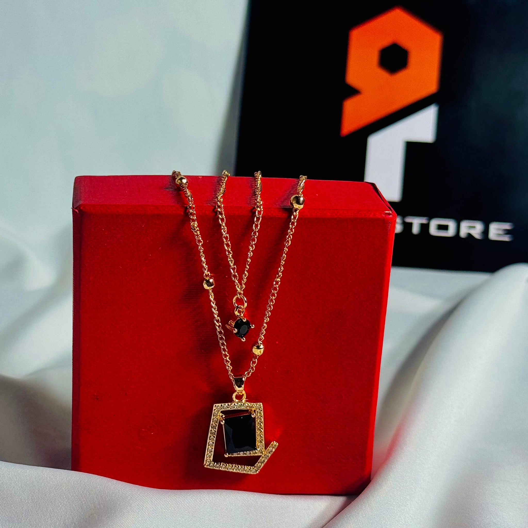 Golden Pendant Necklace With Black Stone & Crystal Accents